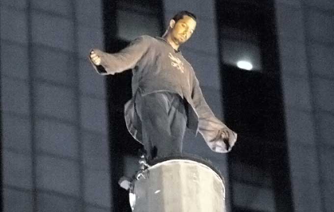 David Blaine standing on a 100 ft pillar