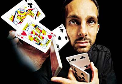 David Blaine holding cards