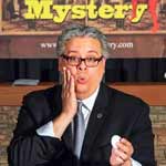 Magician Eric Decamps floating a card with his hands