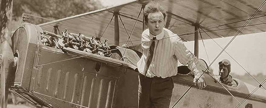 Houdini standing on the wings of a plane