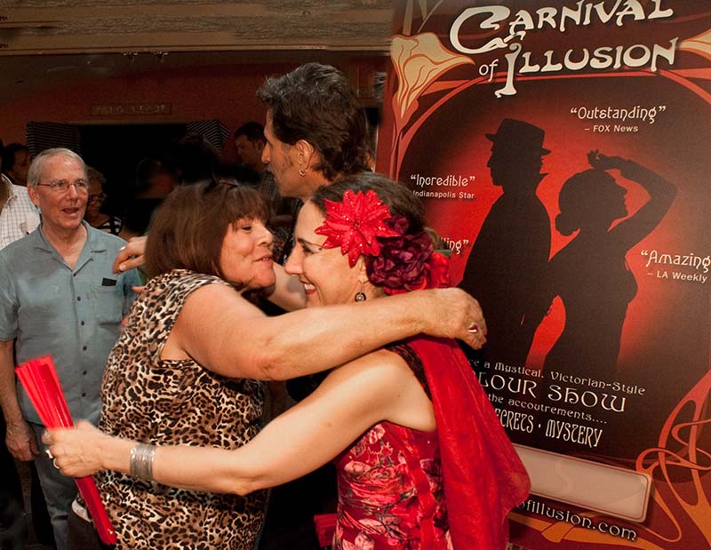 Eyed hugging audience members after a magic show